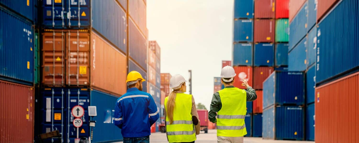 Stock image 3 people with shipping containers